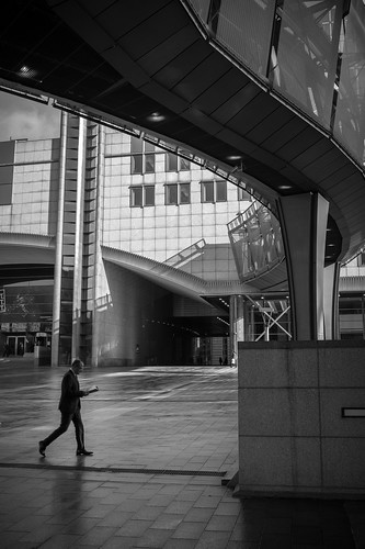 Outside the European Union in Brussels. I liked the shadow and shapes created by this overhead walkway, so I waited until a person walked by. Timing is key and if I waited for the subject to take one more step this would have been a stronger image.