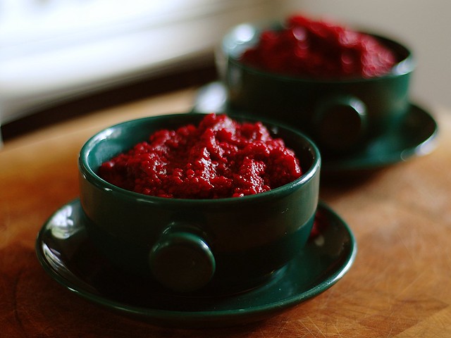 Red soup in green bowls