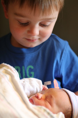Holding His Little Brother For The First time
