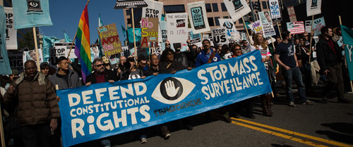 Protesters march through downtown Washington, D.C. during the Stop Watching Us demonstration on October 26, 2013. by Pan-African News Wire File Photos