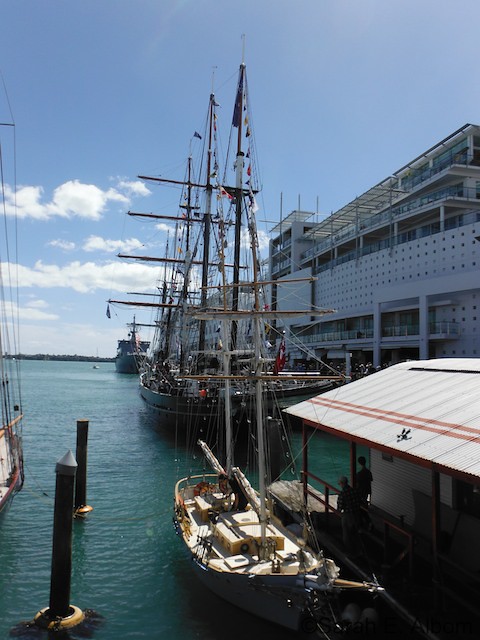 The Spirit of New Zealand in the harbour, visible behind a much smaller boat.