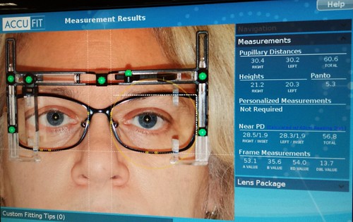 Bionic woman, photographer. We can rebuild her. We have the technology. We can make her better than she was. Better...faster...stronger. Accufit, glasses measurement contraption, Lenscrafters, Northgate Mall, Seattle, washington, USA by Wonderlane