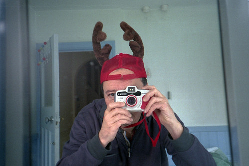 reflected self-portrait with Canon WP-1 camera and back-to-front antlers by pho-Tony