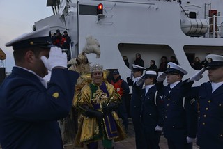 NEW ORLEANS - The Mardi Gras monarch King Rex and his krewe disembark the Coast Guard Cutter Harry Claiborne at Spanish Plaza in downtown to kick off the start of Lundi Gras, March 3, 2014. The 175-foot coastal construction tender delivered the Mardi Gras monarchs Kings Rex and Zulu to kick off the official start of Mardi Gras. U.S. Coast Guard photo by Petty Officer 1st Class Bill Colclough.