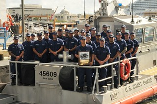Crewmembers from Coast Guard Station San Juan take a group photo after being presented with the Sumner I. Kimball Readiness Award Sept. 18, 2013 at Coast Guard Sector San Juan, Puerto Rico. Photo by Ricardo Castrodad, Sector San Juan public affairs specialist. 