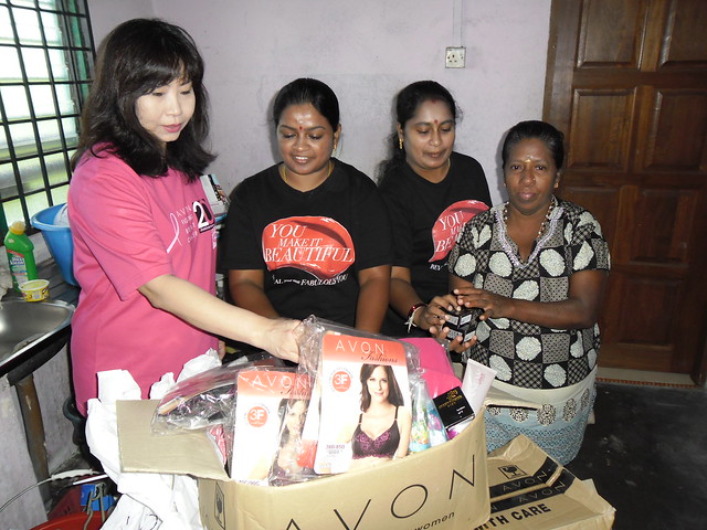 AVON HQ team present donation to Azizah (AVON representative)_edited.jpg