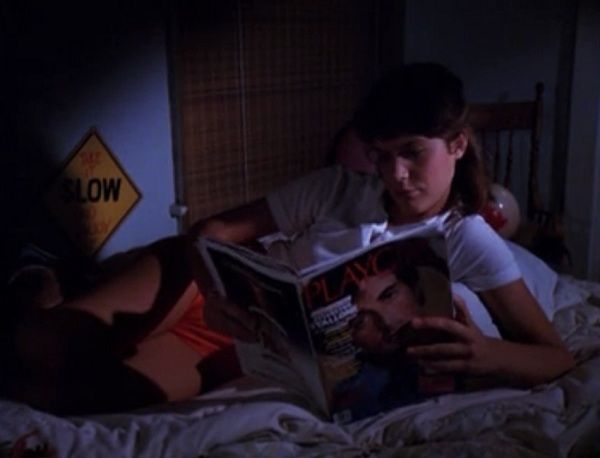 Valerie reading alone in bed