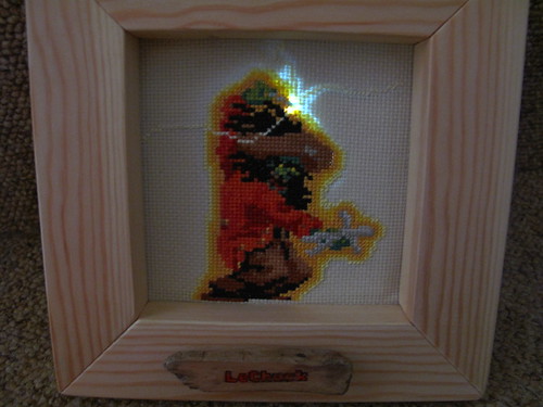 LeChuck's pin lit up as he goes for the voodoo doll of Guybrush
