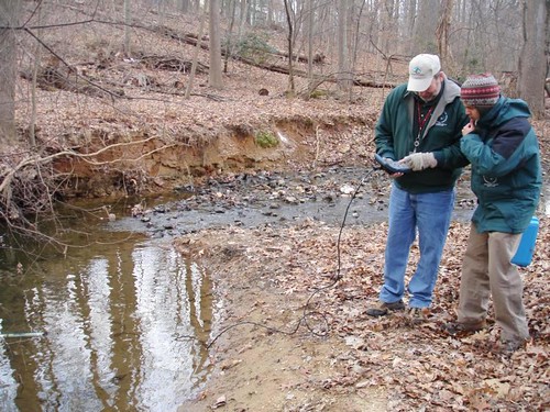 Image of DEP staff monitoring a local stream for water chemistry.
