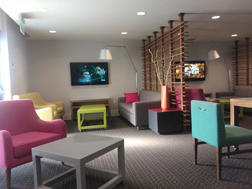 Avatar Hotel, contemporary meeting room, individual TVs, sofas, tables, light, dividers, Santa Clara, California, USA by Wonderlane