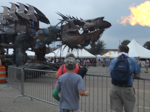 Very large metal sculpture sharped like a dragon breathing fire