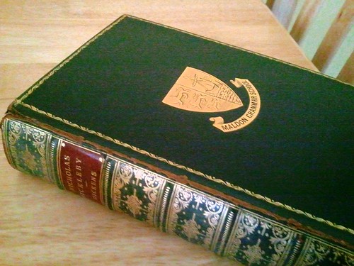 An edition of Nicholas Nickleby, by Charles Dickens, with the seal of Maldon Grammar School on the cover
