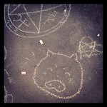 Obligatory piggy and occult symbols - chalk drawings at #sarjakuvafestivaalit
