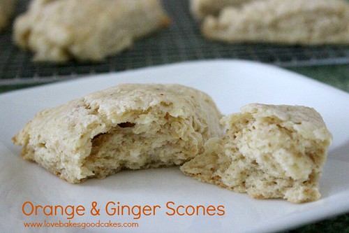 Orange & Ginger Scones pulled a part on white plate.