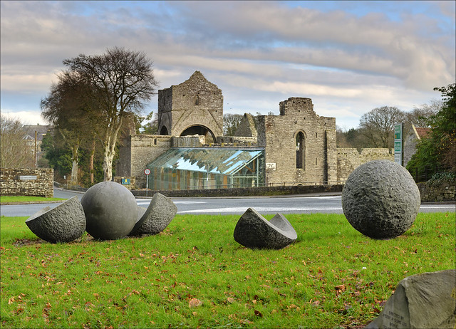 Boyle Abbey with the 'Brothers' sculpture in foreground