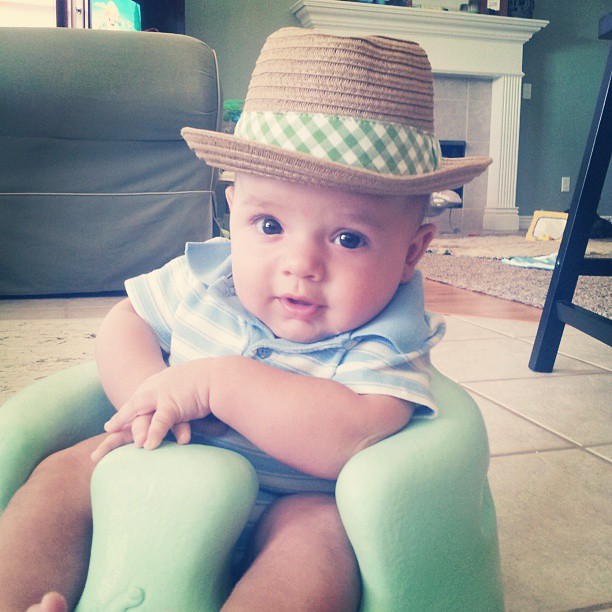 The teether is rockin' the fedora look rather well.