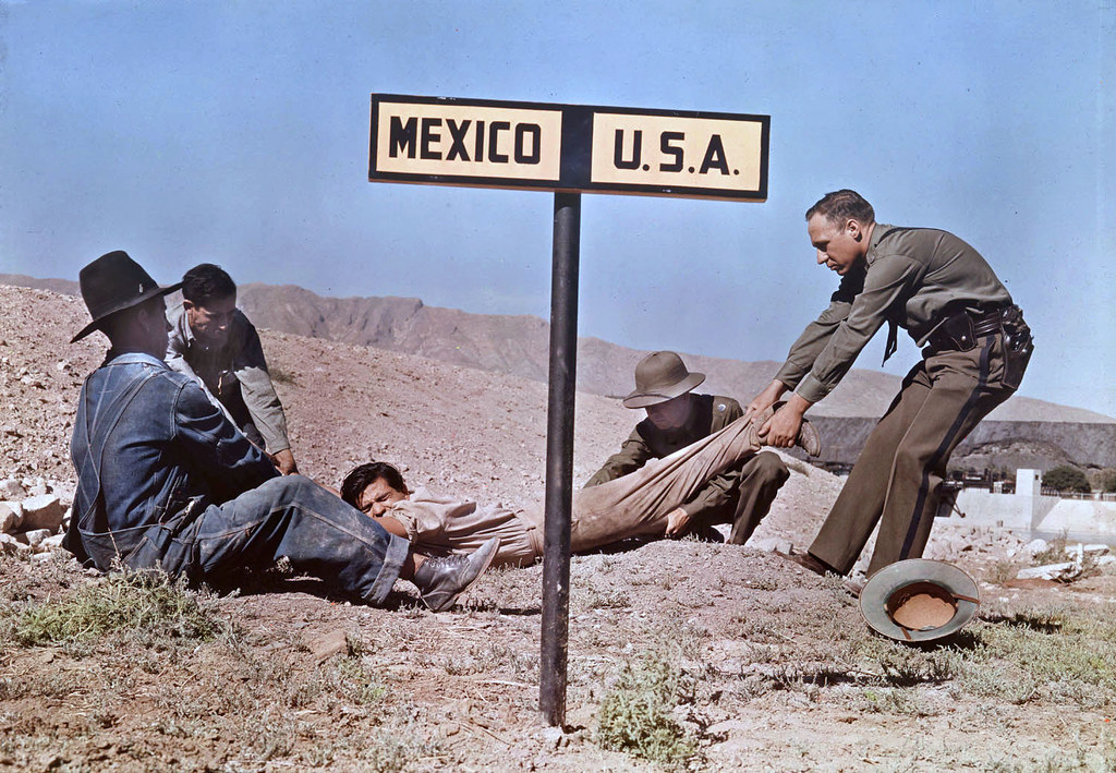 Circa 1939 - Dragging a fugitive across the border, near El Paso, Texas, USA