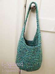 Completed shopping bag hanging from a door knob