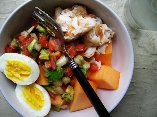hardboiled egg, leftover tilapia and tomato, avocado, and sweet onion salsa from fish tacos, and cantaloupe