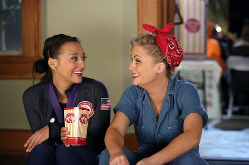 Leslie Knope dressed as Rosie the Riveter with Ann dressed as an Olympic gymnast for Halloween. 