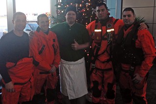Crewmembers of an HH-65 Dolphin rescue helicopter from Coast Guard Air Station Atlantic City, N.J., pose with a man they rescued from aboard his 31-foot sailboat Tuesday Dec. 24, 2013. The man was rescued near Pooles Island and transferred to Baltimore Washington International Airport after his friend reported him overdue. U.S. Coast Guard photo