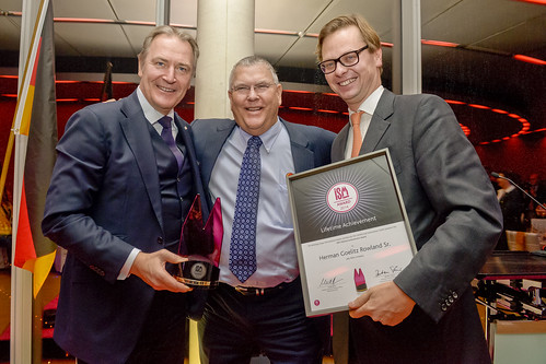 Mr. Rowland receives the first ISM Lifetime Achievement Award. (from left to right): Gerald Böse, CEO Koelnmesse GmbH; Herman Goelitz Rowland Sr., Chairman of the Board, Jelly Belly Candy Company, Bastian Fassin, Chairman of the International Confectionery Fair Taskforce (ASIM)