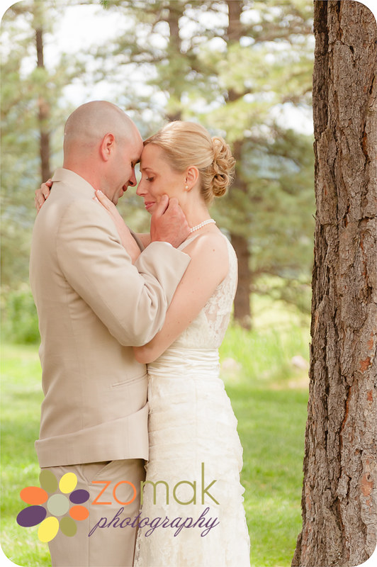 Bride and Groom embrace moments after their first look at the Double Arrow Resort in Seeley Lake, MT