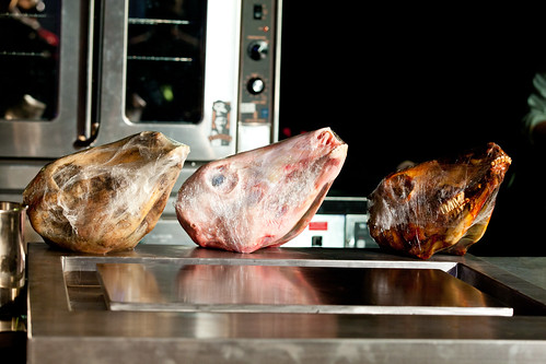 Row of veal heads from raw to roasted for Chef Michael Toscano of Perla's workshop