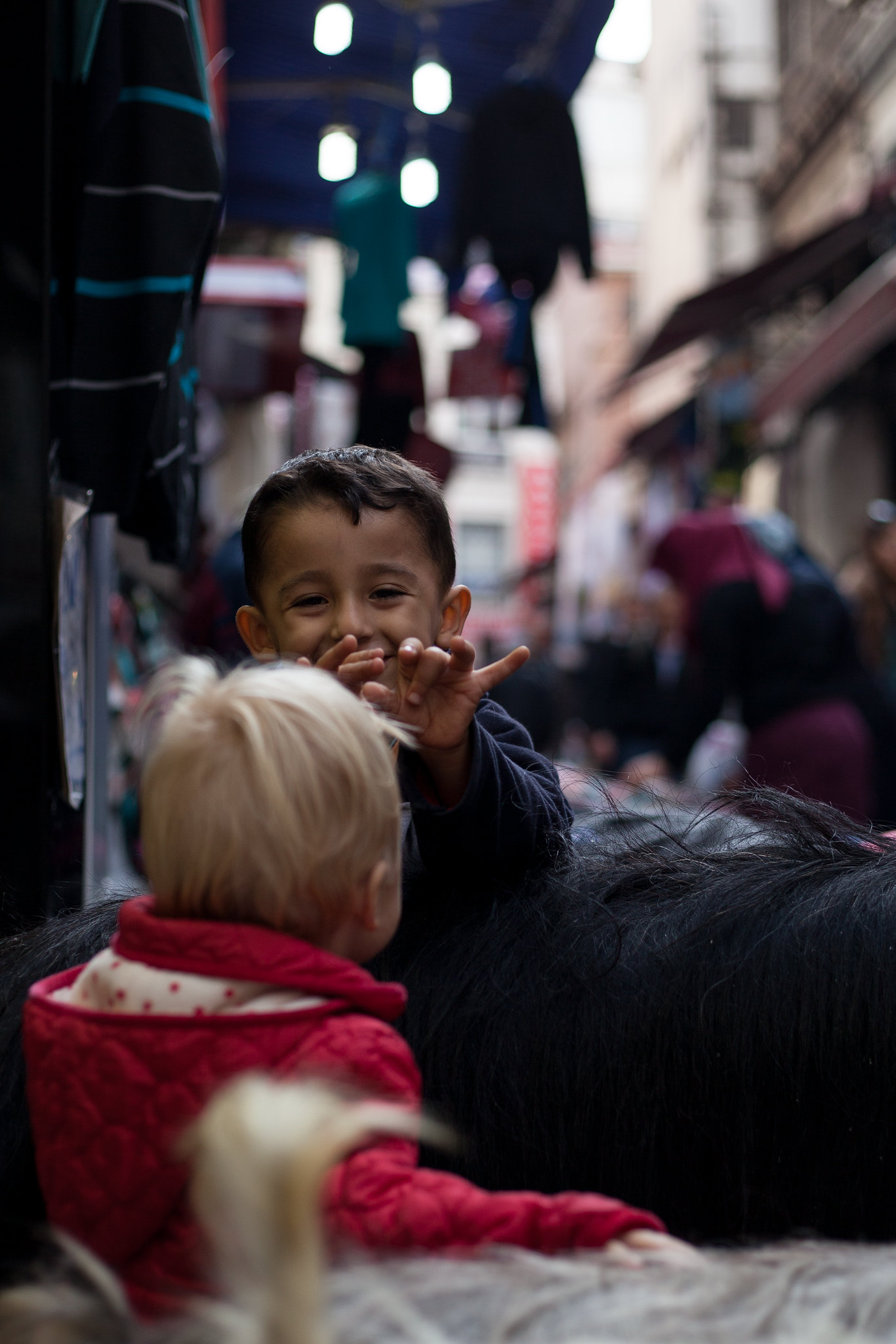 Boy talking to Neve over a stuffed goat, Eminönü.