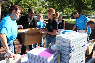 Sara Vega, Henderson Butler, Kristie Ackerman and Amy Mulholland pack up supplies during Michigan Mutual, Inc.'s Stuff the Bus school supply drive.