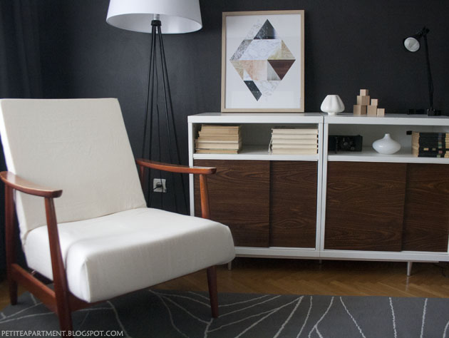 mid century modern chair and cabinet in the living room with black dark grey walls apartment inspiration ikea besta gislev