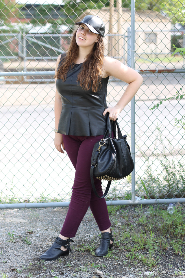 Leather Pops Outfit: Plum AG Stevie Ankle Jeans from Anthropologie, faux leather peplum top from Urban Outfitters, black leather Jeffrey Campbell Everly cutout ankle boots, leather baseball cap, studded-bottom bag