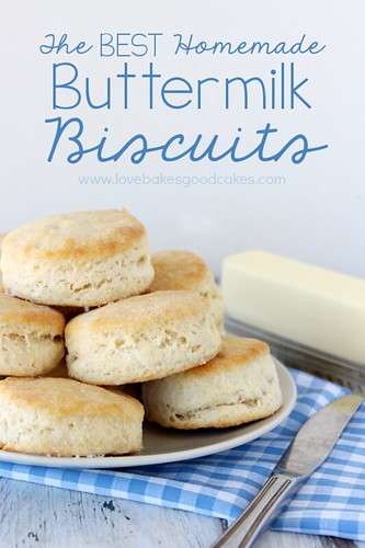 The BEST Homemade Buttermilk Biscuits stacked up on plate with butter and a butter knife.