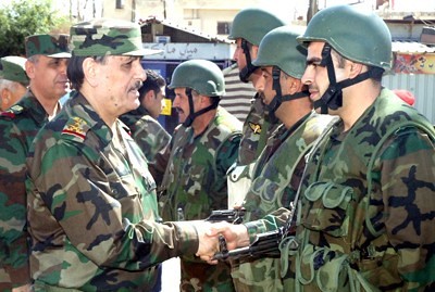 Syrian military officers congratulates troops on efforts to defeat western-backed rebels fighting against the government in Damascus. by Pan-African News Wire File Photos