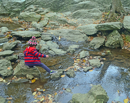 Clara Chambers, 6 years old, hops along the rocks during a recent camping trip with her family. (U.S. Forest Service photo) 
