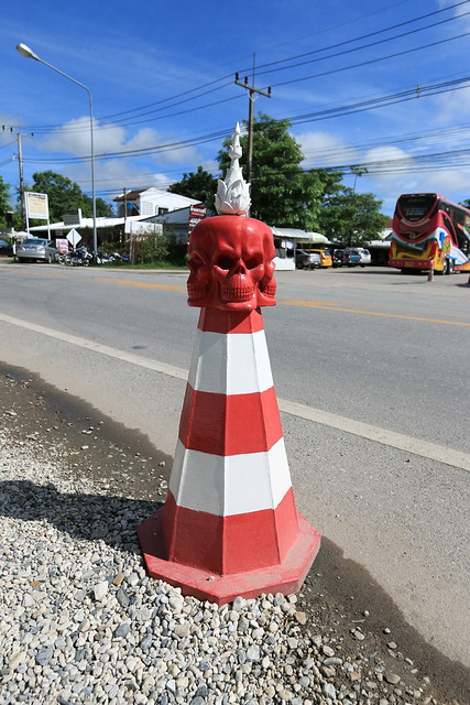 Chiang Rai - Wat Rong Khun traffic cone mounted with a skull