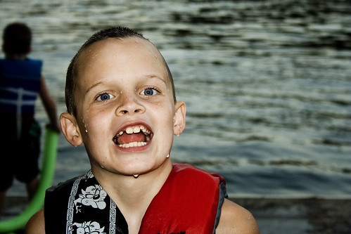 boy sunset red lake funnyface water smile swimming mouth dock dusk teeth missouri nephews lakeoftheozarks lifejacket