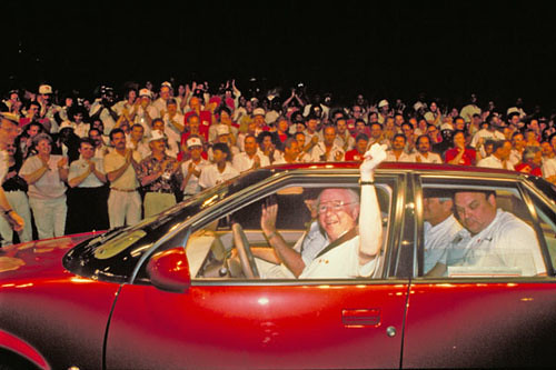 GM Chairman Smith Drives first Saturn off line.