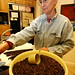 anna, winnowing chaff from fresh roasted coffee    MG 7056