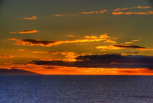 ocean chile sea sky orange sun sunlight southamerica water clouds sunrise coast photo earthquake puntaarenas 200801