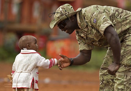 A Soldier is Welcomed to Kenya by a Young Child