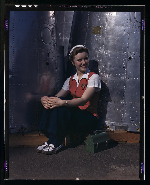 A noontime rest for a full-fledged assembly worker at the Long Beach, Calif., plant of Douglas Aircraft Company. Nacelle parts for a heavy bomber form the background  (LOC)