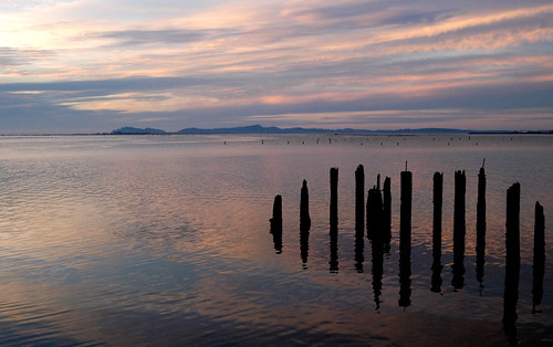 sunset water clouds coast pilings washingtonstate supports