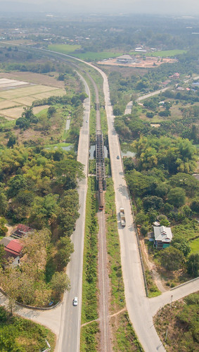 aerialphotography aerialview bridge city day dronephotography green color highangleview industry landscape nopeople outdoors railway track road traintracks transportation tree