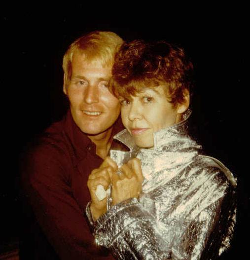 Vera-Ellen wearing a silver jacket posing with friend and fan Bill Dennington
