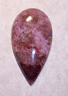 Rhodonite Designer Gemstone Cabochon 43 x 23 x 6 and 12.6 Grams Domed with Flat Outer Rim.