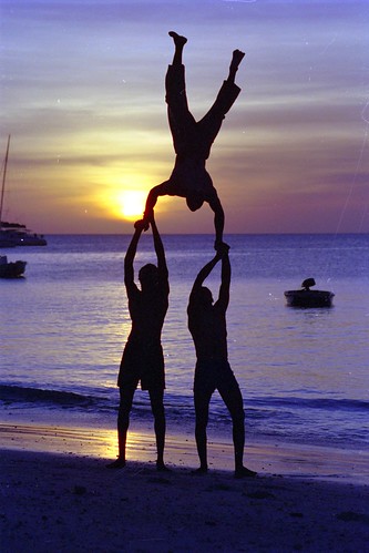 sun silhouet silhouette colors purple nungwi sea people acrobates sunset beach 2004 tanzania zanzibar
