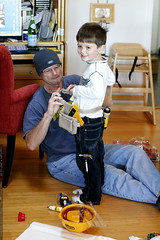 grandpa helping nick with his builder's tool belt   … 