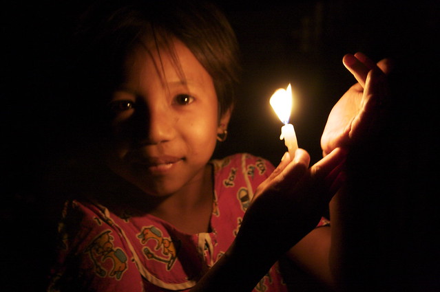 Lighting Candles At The Shwezigon Temple, Bagan