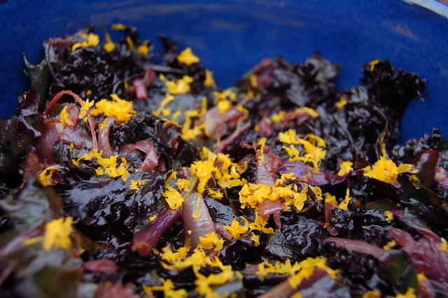 Wilted kale salad with balsamic vinegar, caramelized onions and orange zest